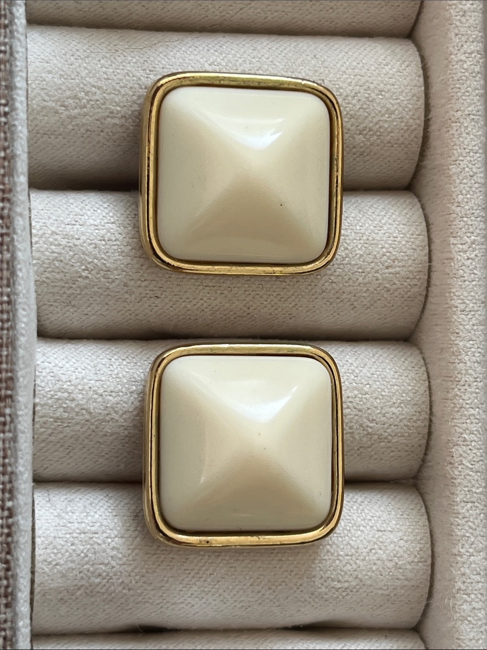 vintage Trifari earrings have a gold trim and are pyramid style